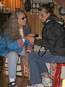 Nancy King and Ingrid Jensen engaged in girl talk at the annual Centrum faculty party.